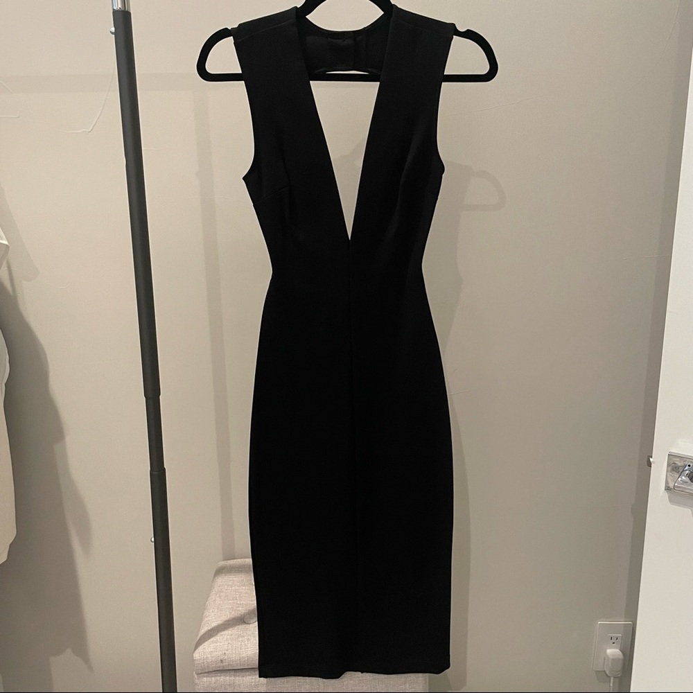 Lulu’s black midi dress. Deep v front cut. Open back. Size XS